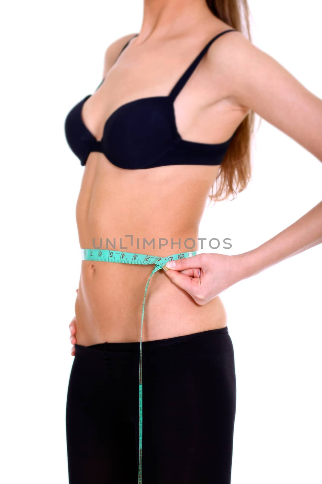 Fitness young woman in white isolated