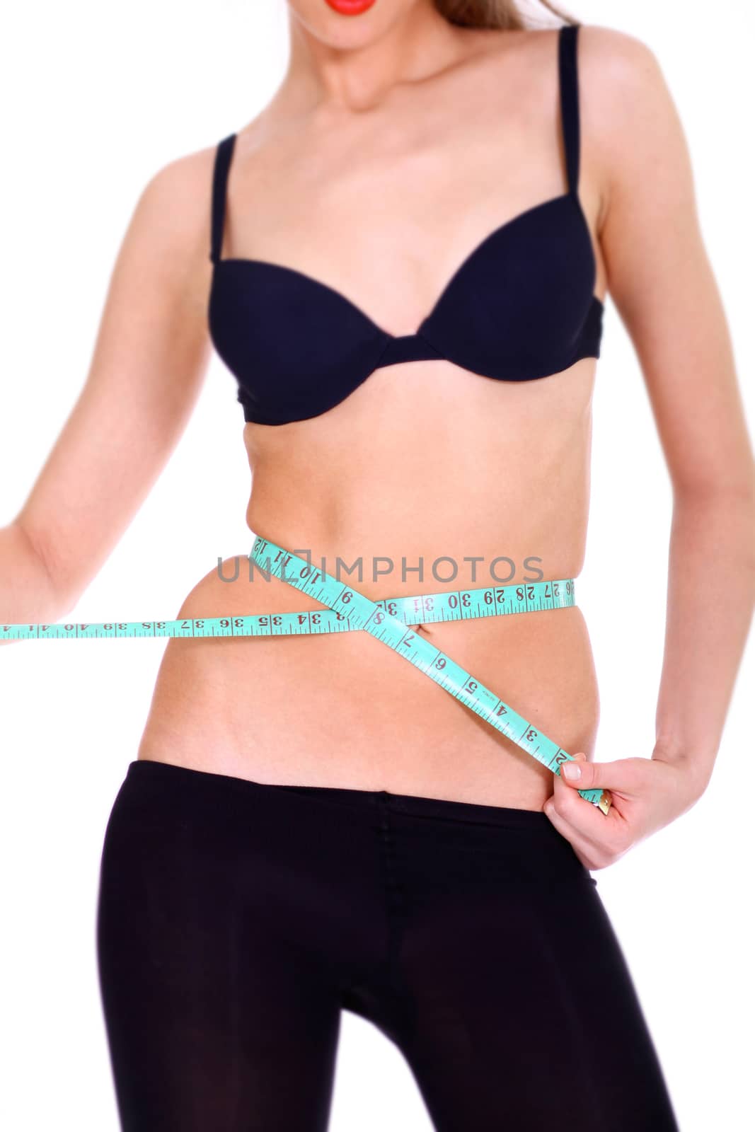 Fitness young woman in white isolated