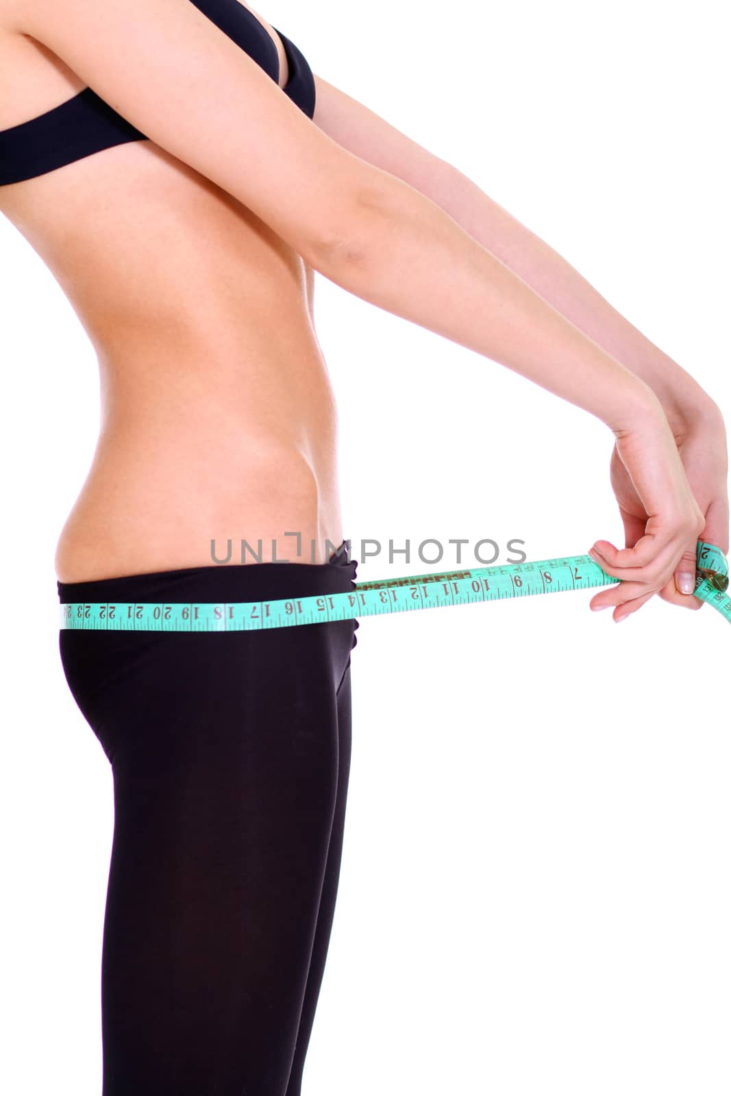 Fitness young woman in white isolated