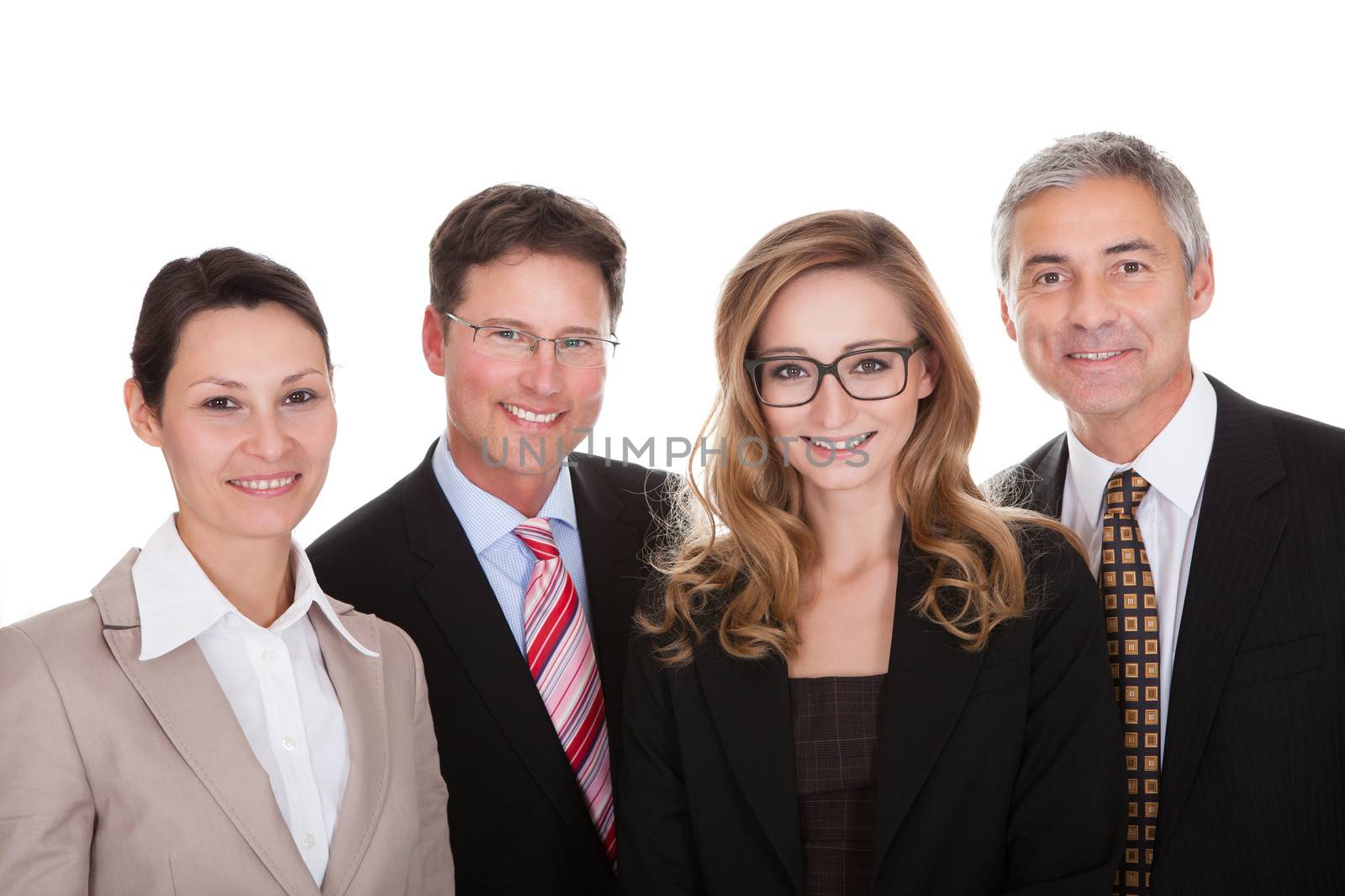 Smiling group of stylish business professionals standing in a row with their arms folded looking at the camera isolated on white