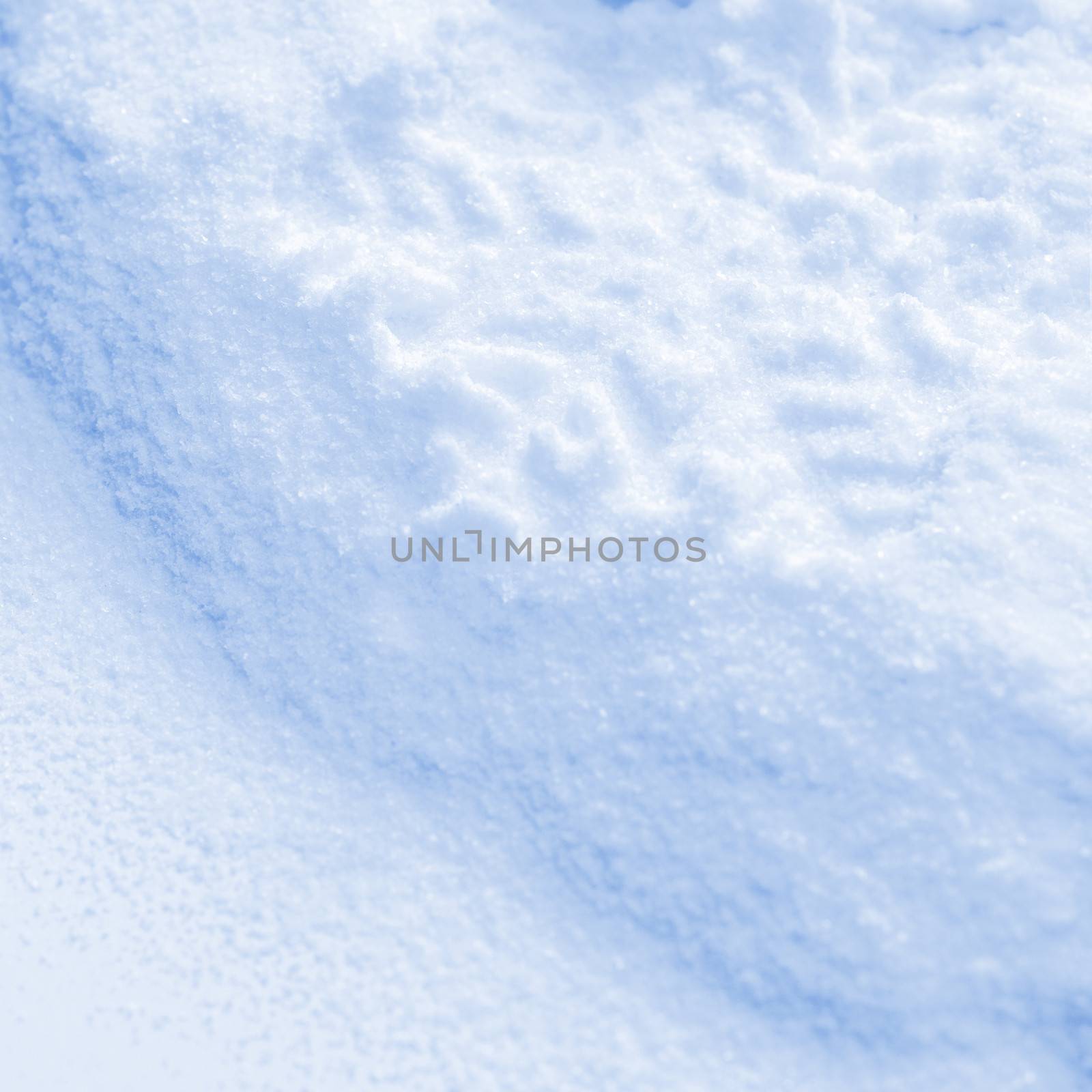 Snowflake on the snow. White xmas holiday background.