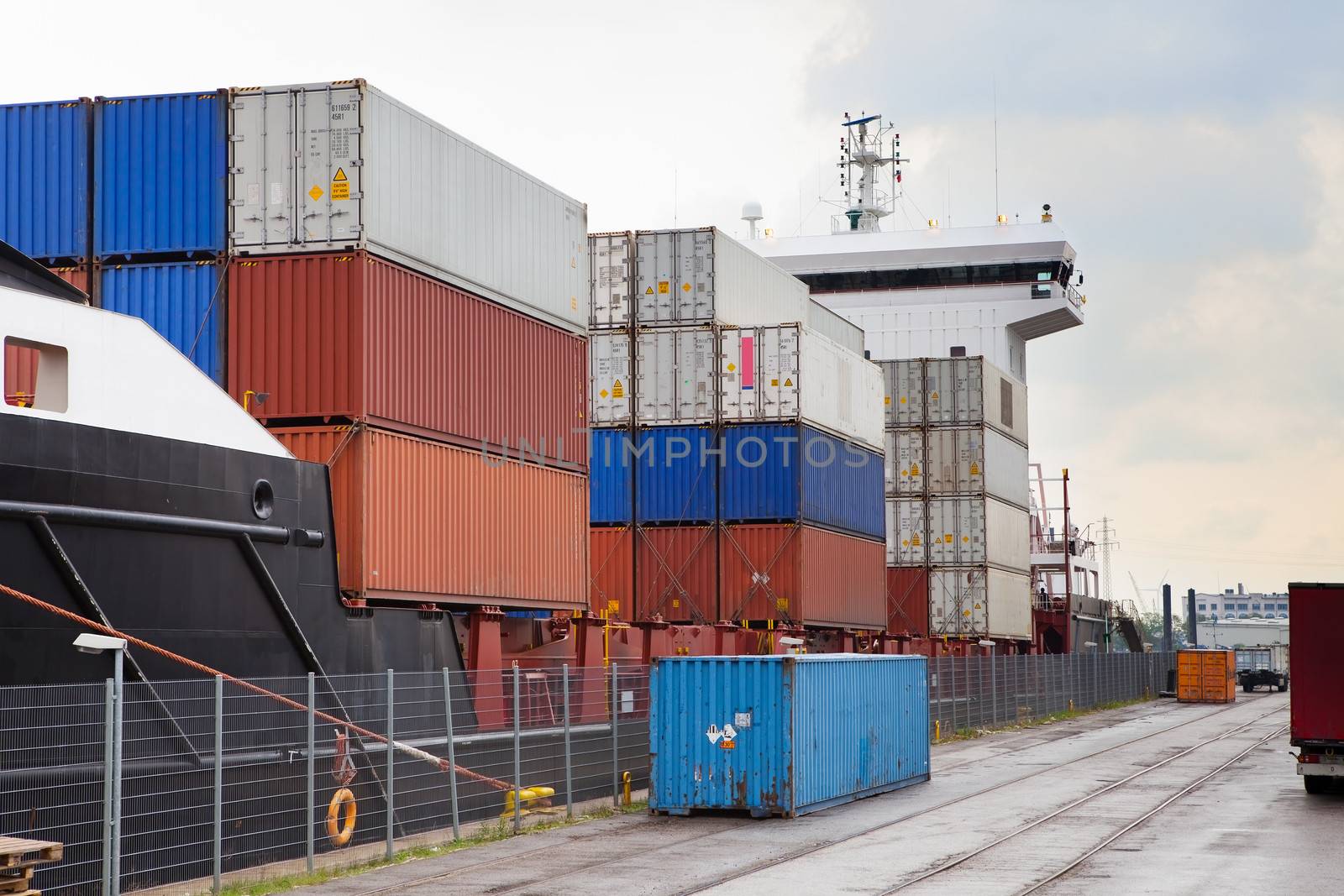 Container ship fully loaded in port terminal