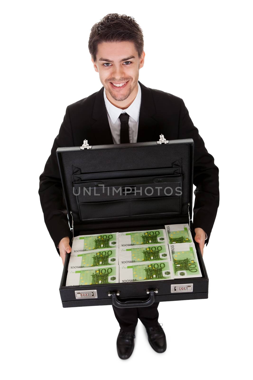 Businessman with suitcase full of cash. Isolated on white