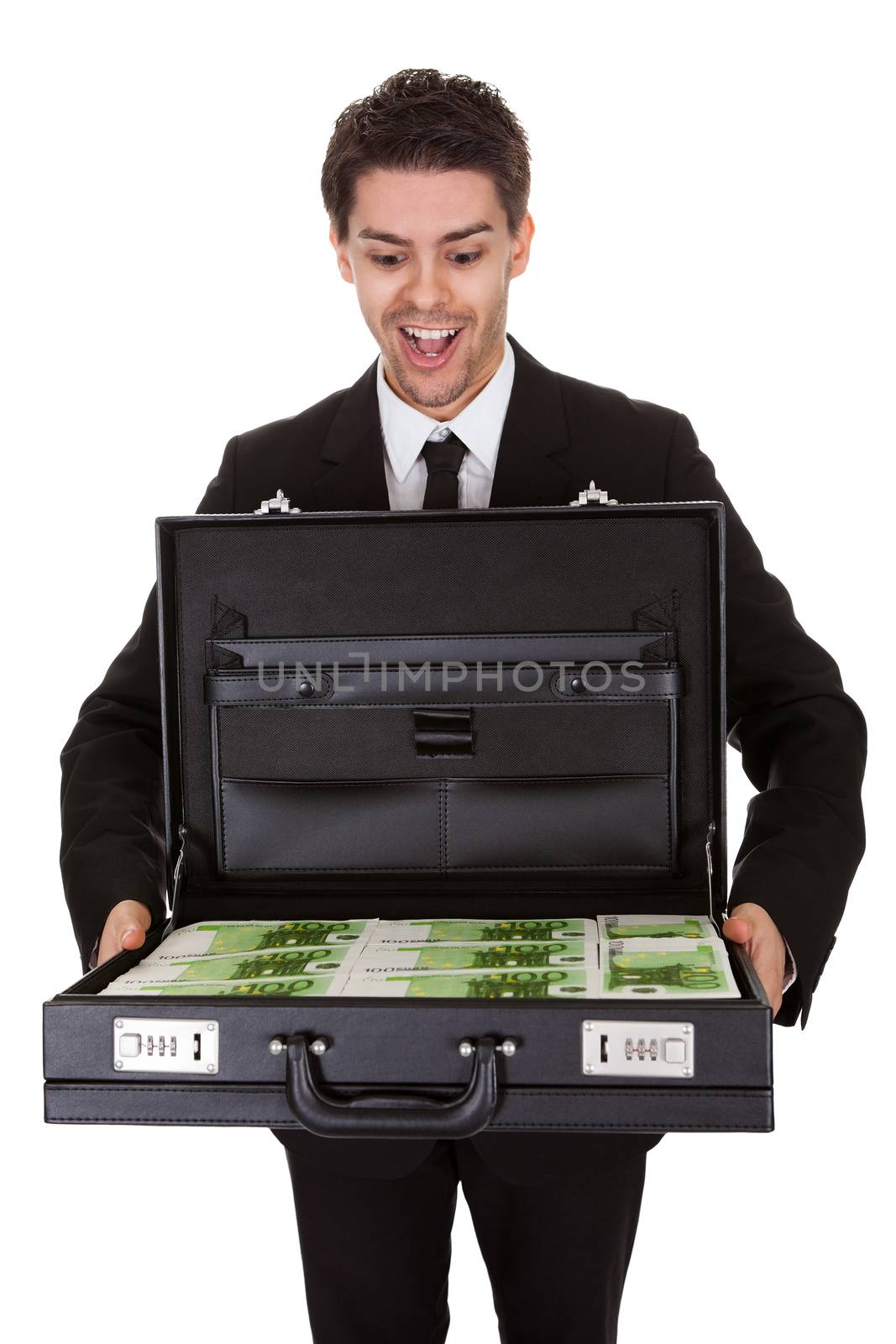 Businessman with suitcase full of cash by AndreyPopov