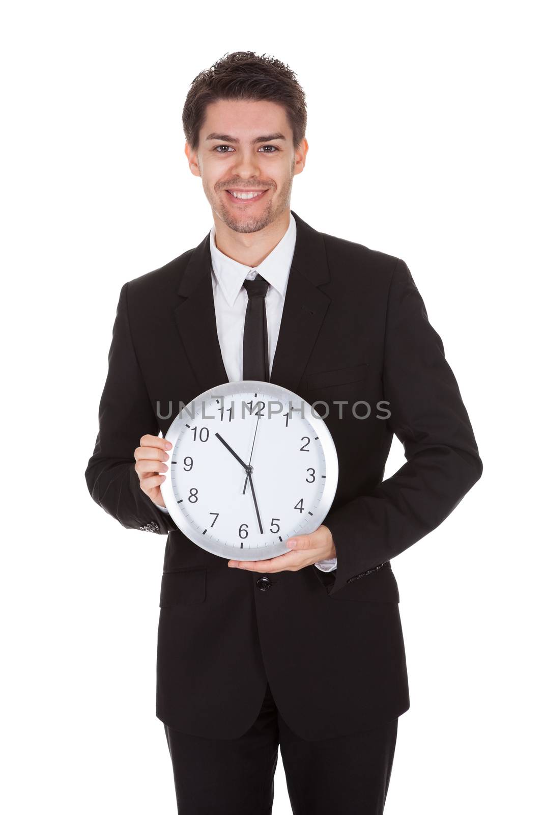 Portrait of businessman with clock by AndreyPopov