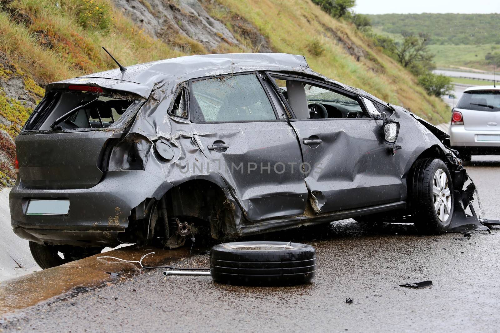 Modern automobile stuck on the road after rolling in the wet weather