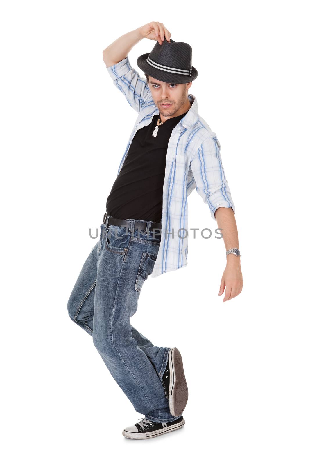 Young dancer touching his hat and one arm outstretched