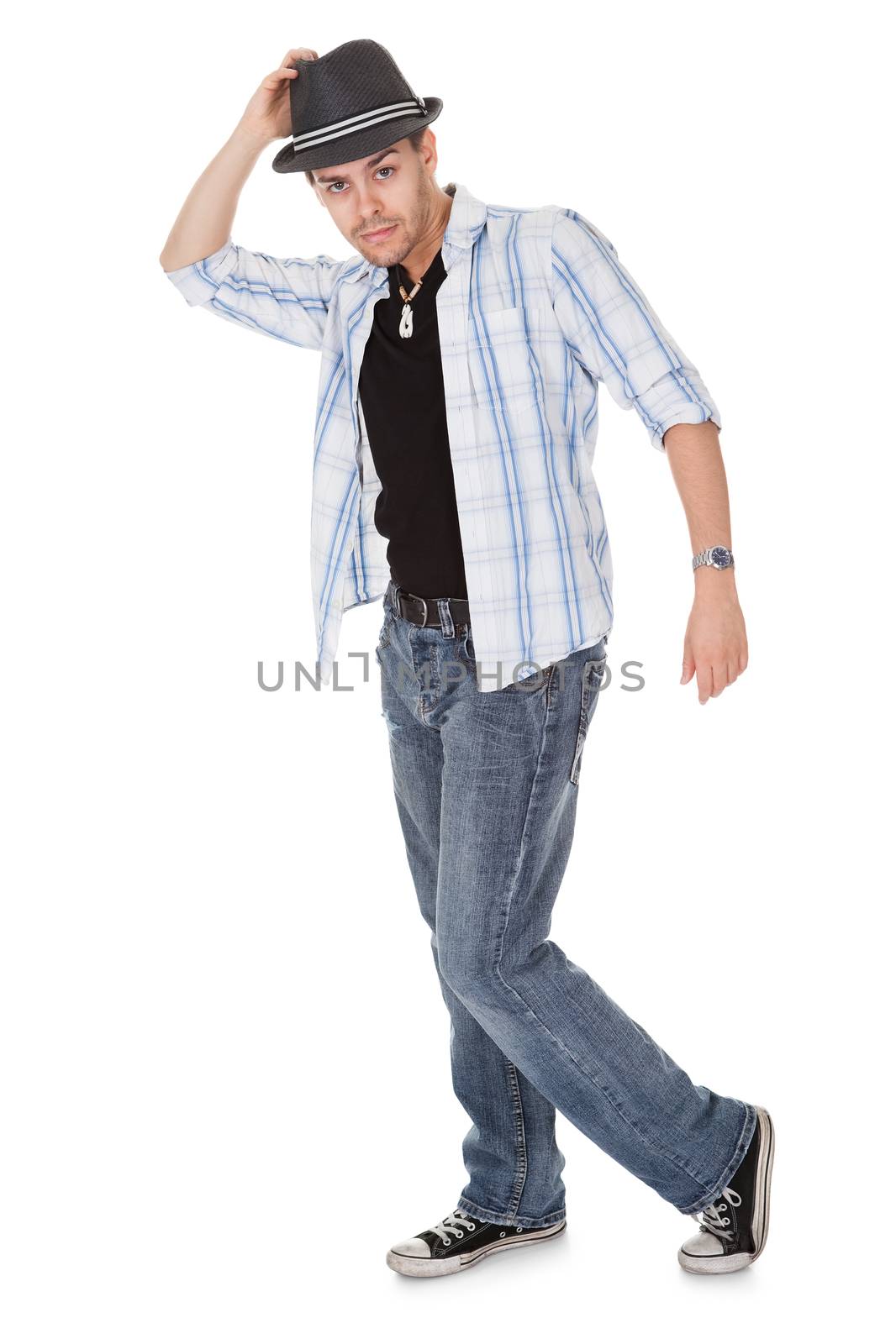 Young dancer touching his hat and one arm outstretched