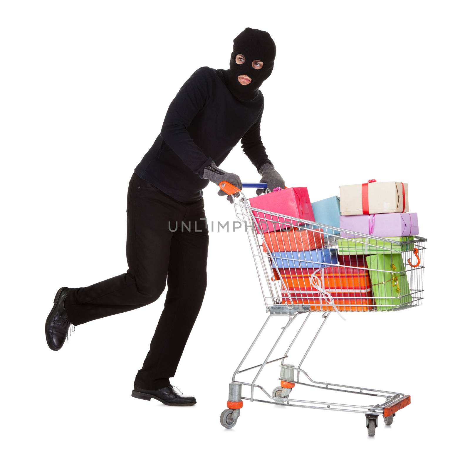 Thief pushing a trolley of gifts by AndreyPopov