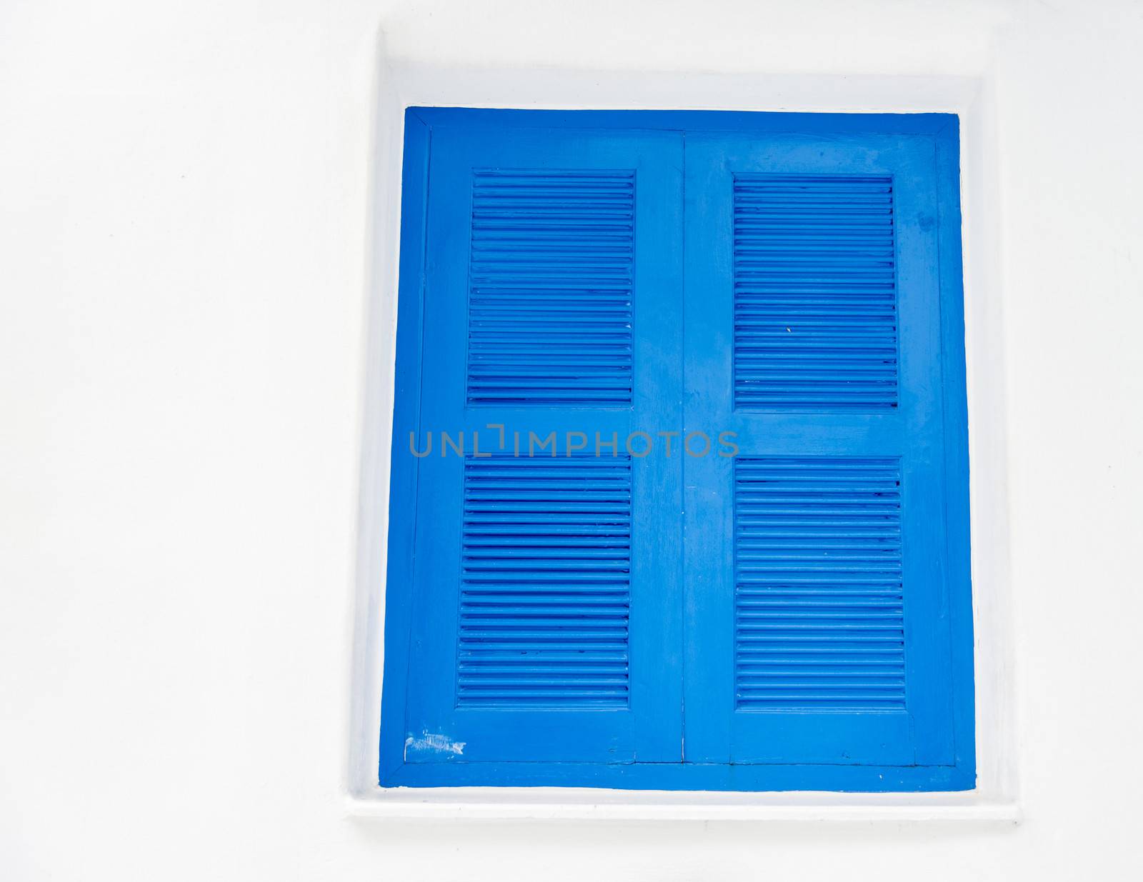 Closed blue window with white wall1 by gjeerawut