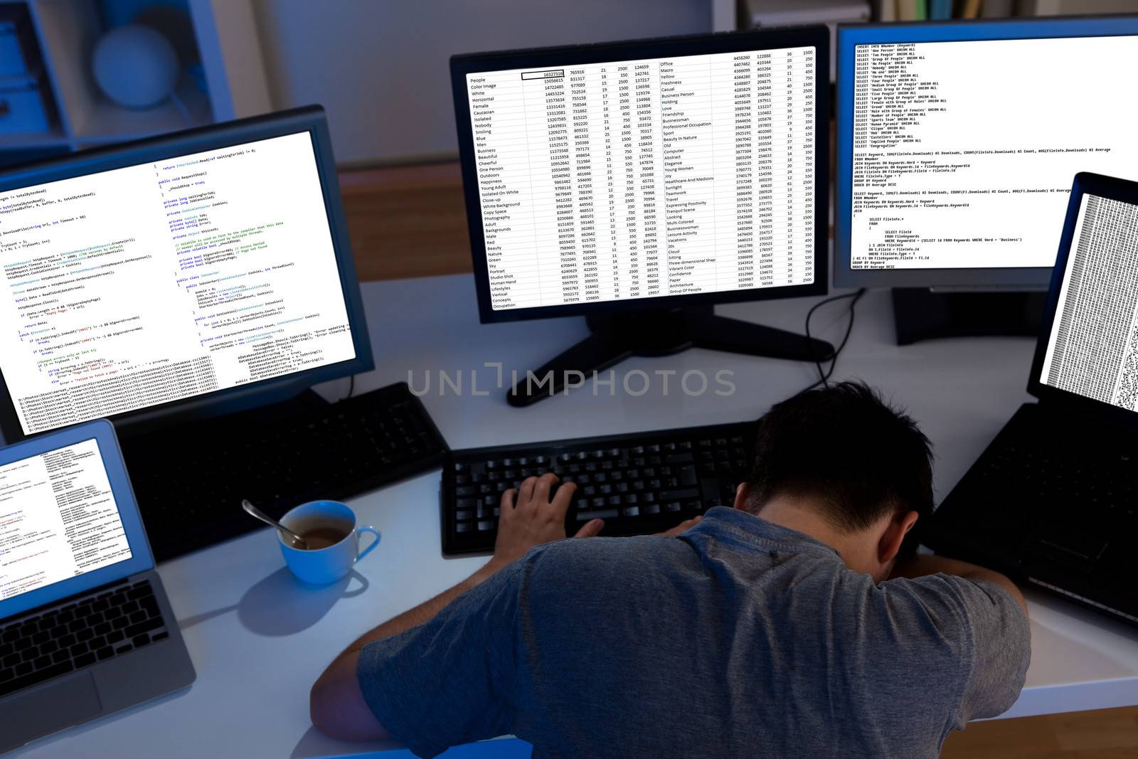 Computer programmer sleeping in the office at night