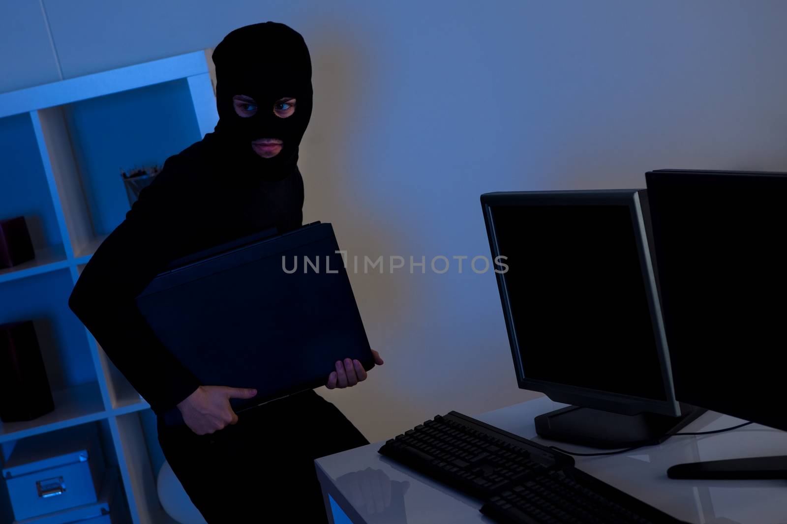 Thief steeling a computer by AndreyPopov