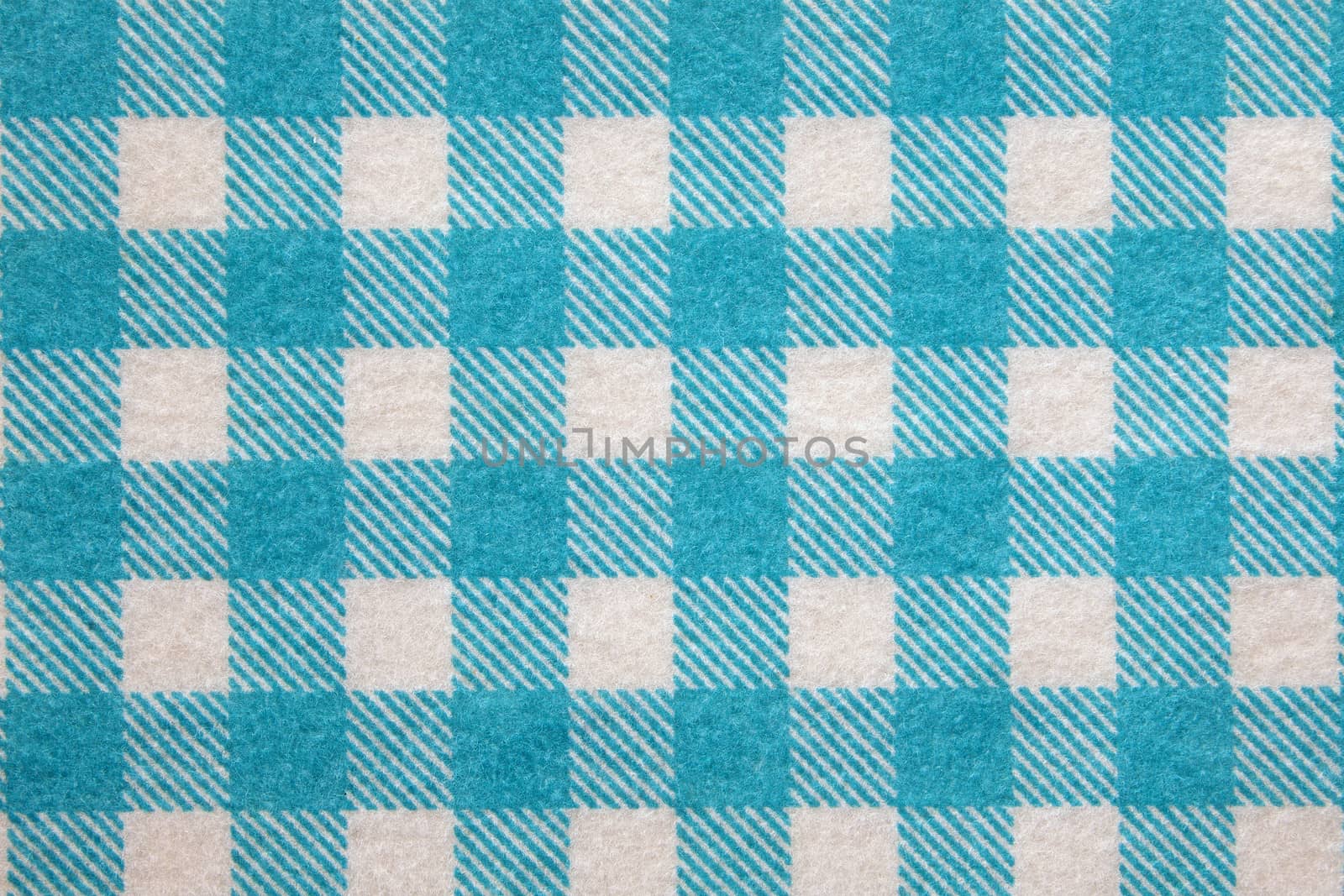 Material into blue grid, a textile background.