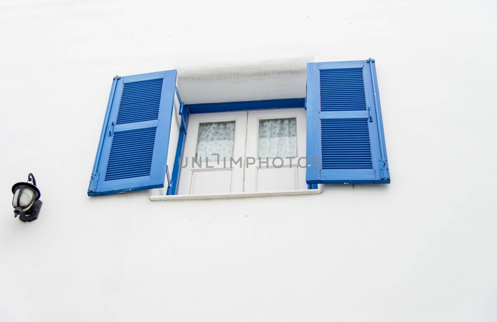 Opened blue window on white wall4