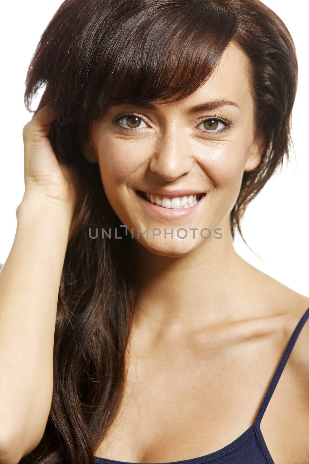 Beautiful young woman smiling on white background