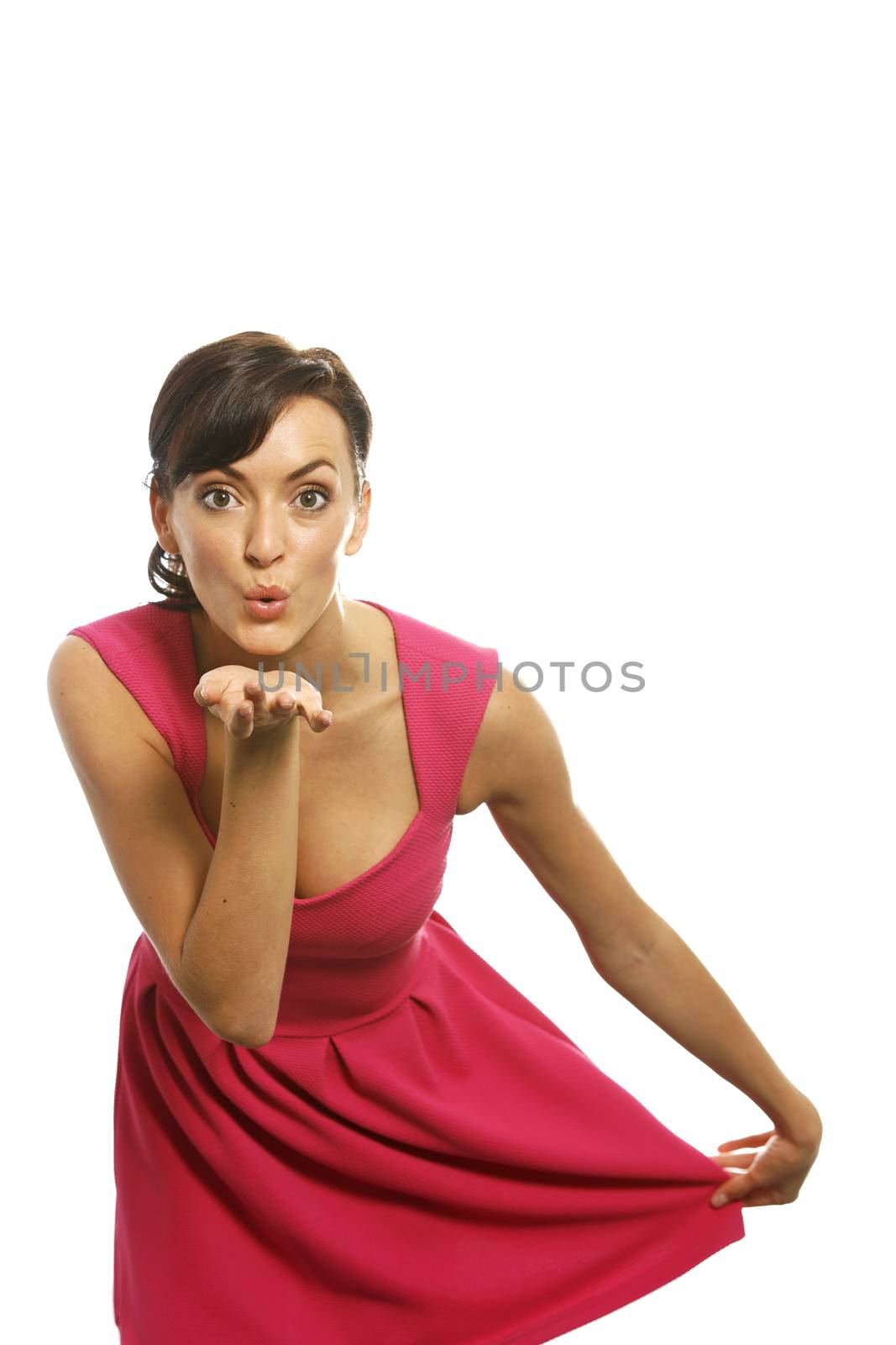 Young woman blowing a kiss across her palm