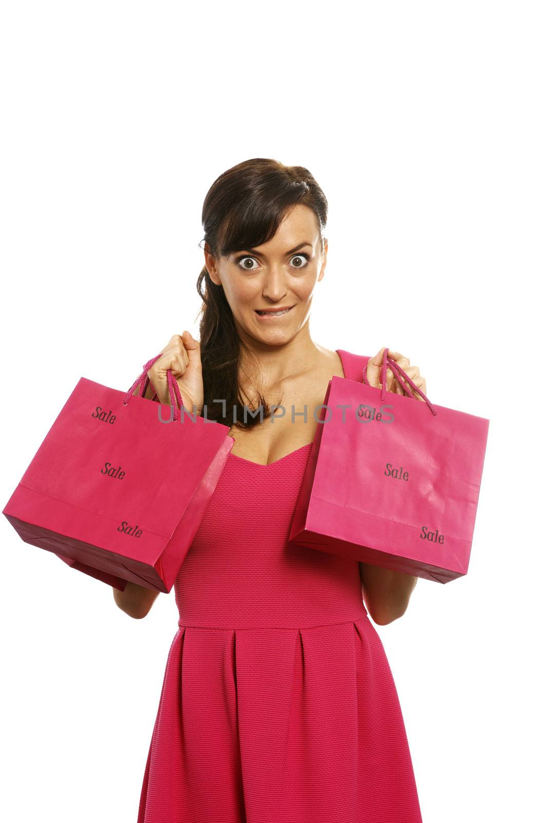 Young woman looking excited with shopping bags