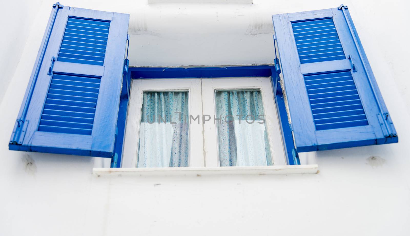 Opened blue window on white wall2 by gjeerawut