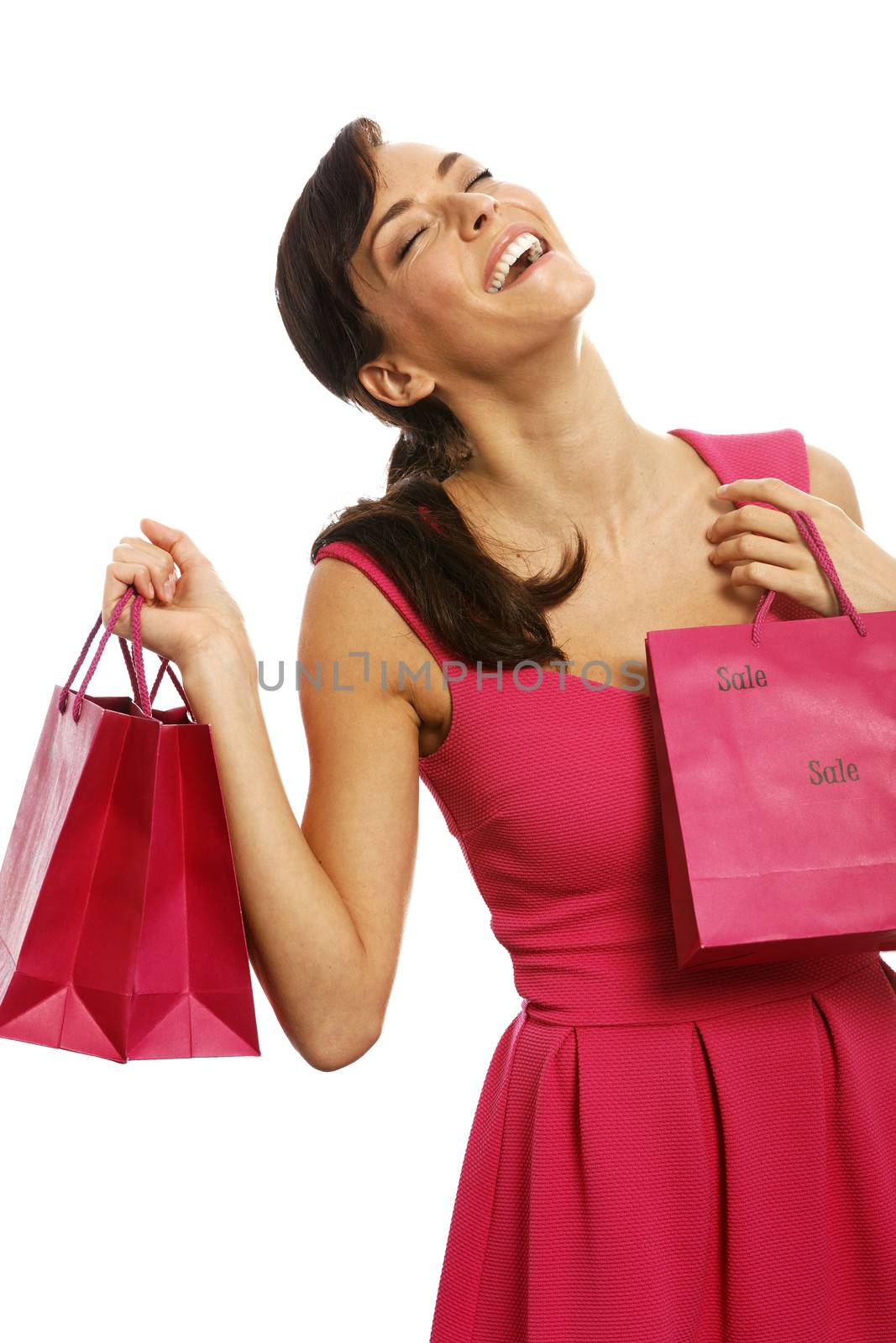 Young woman looking excited with shopping bags