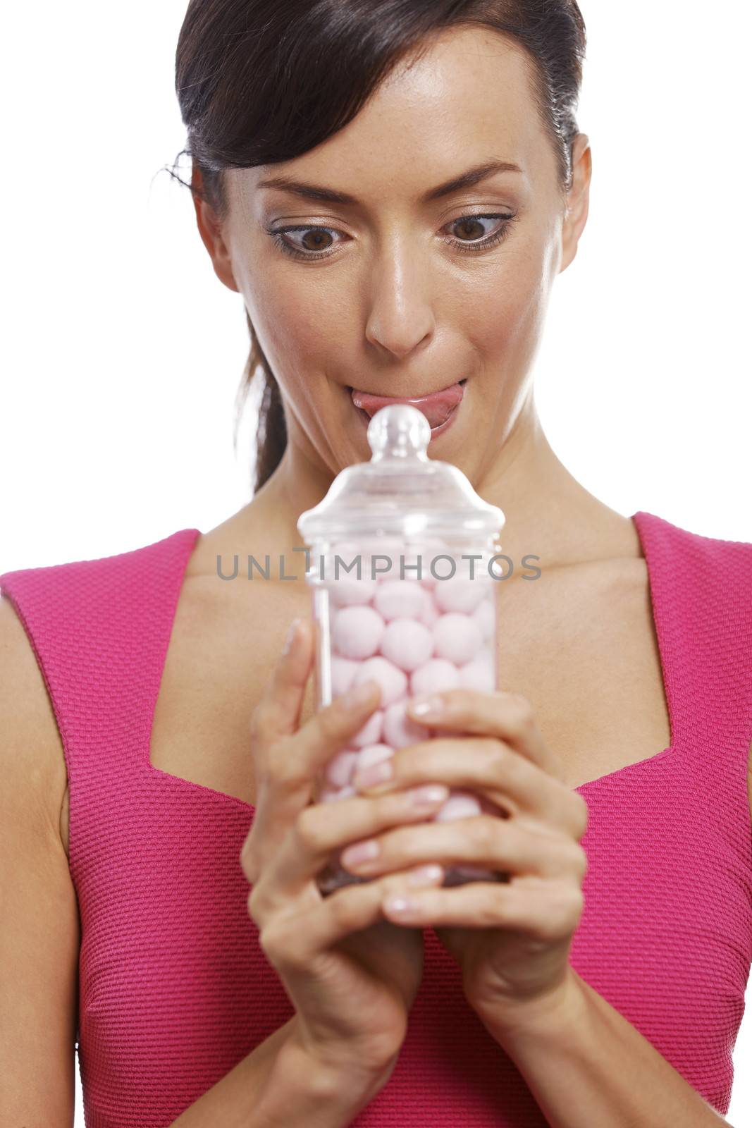 Young woman holding a sweet jar