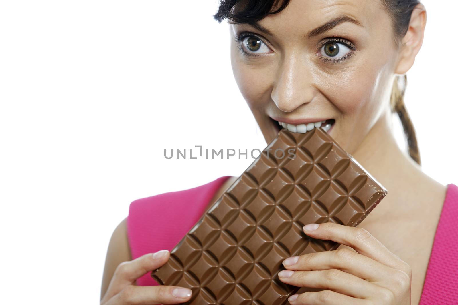 Young woman eating a huge chocolate bar