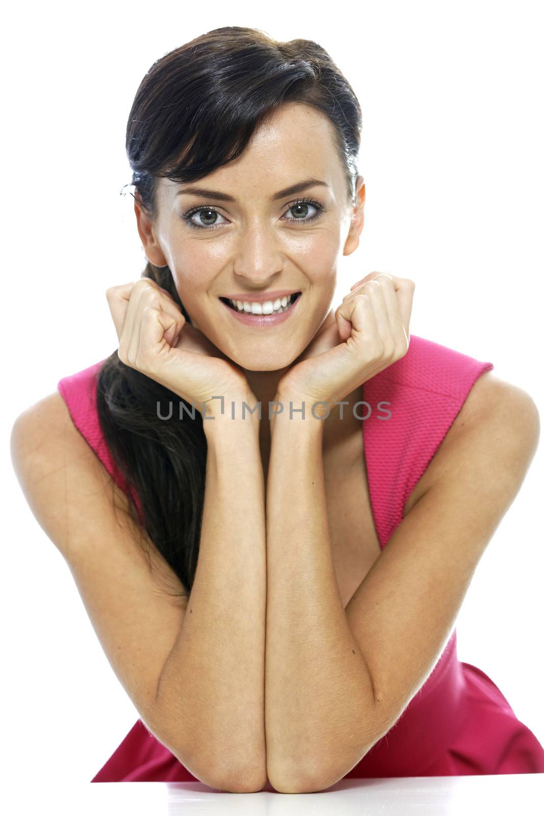 Young beautiful woman resting on her elbows smiling