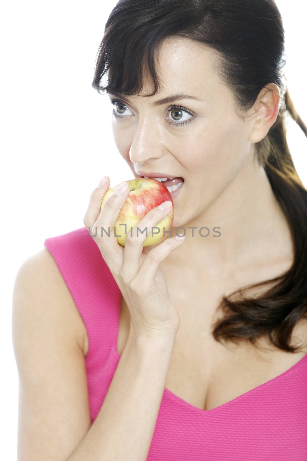 Young woman holding a fresh apple.