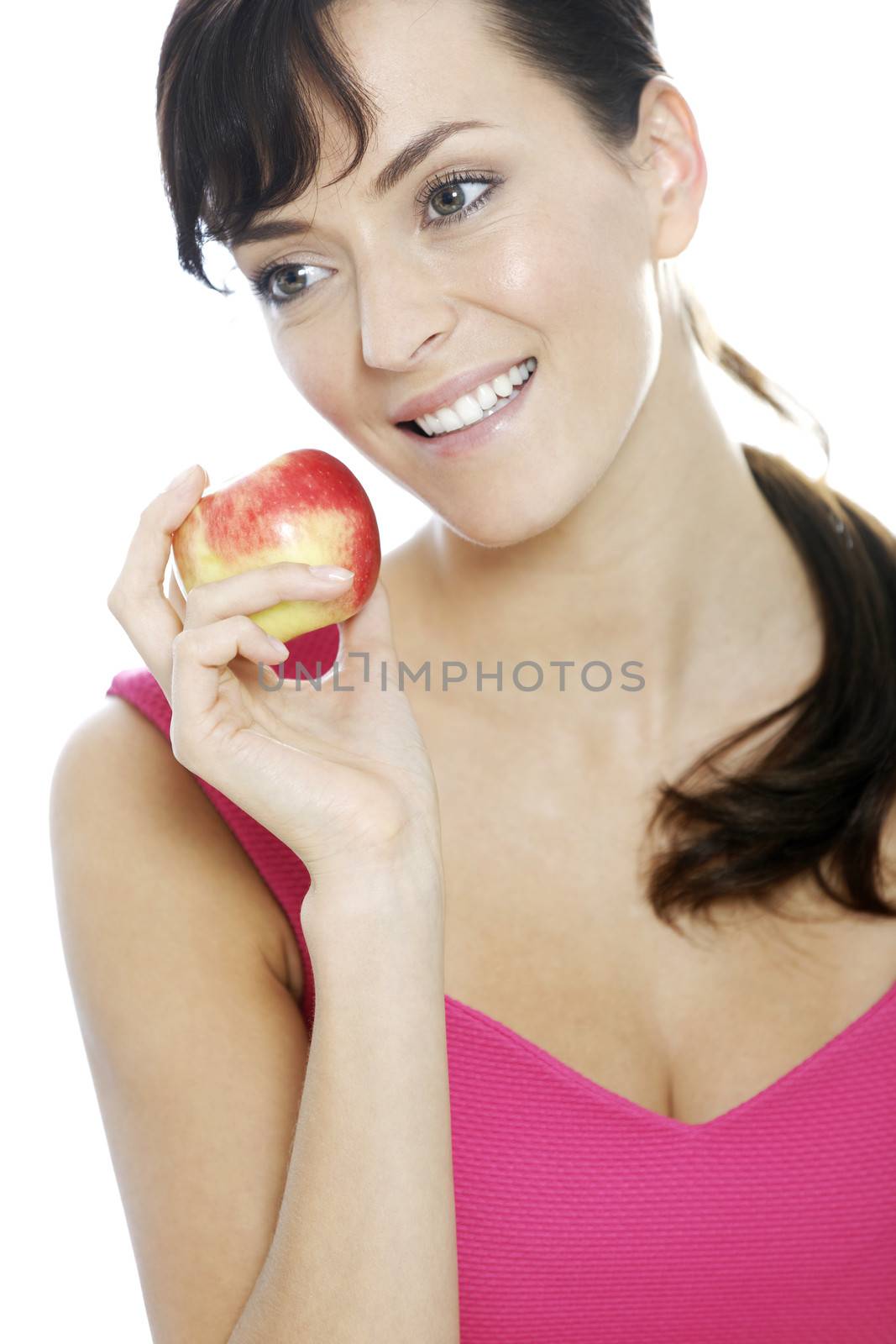 Young woman holding a fresh apple.