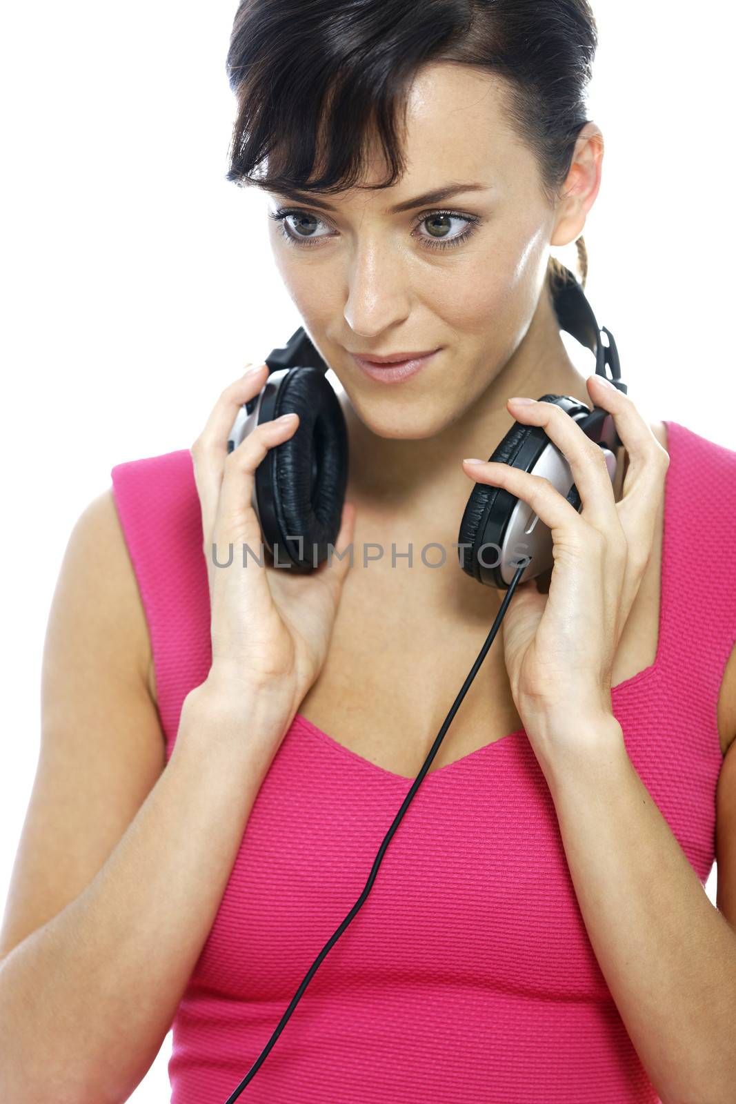 Young woman listening to music on her headphones.