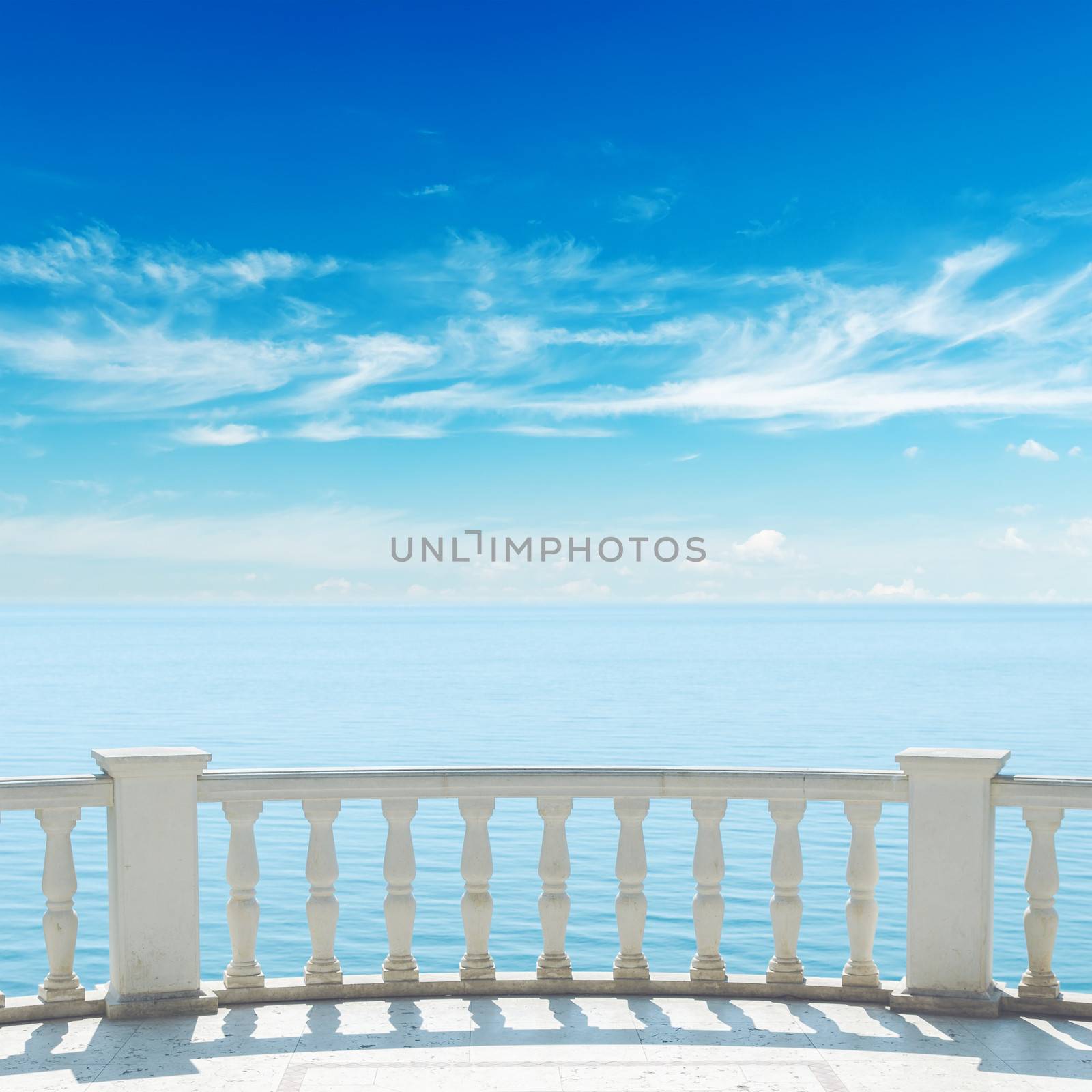 view to sea from terrace with balcony under cloudy sky