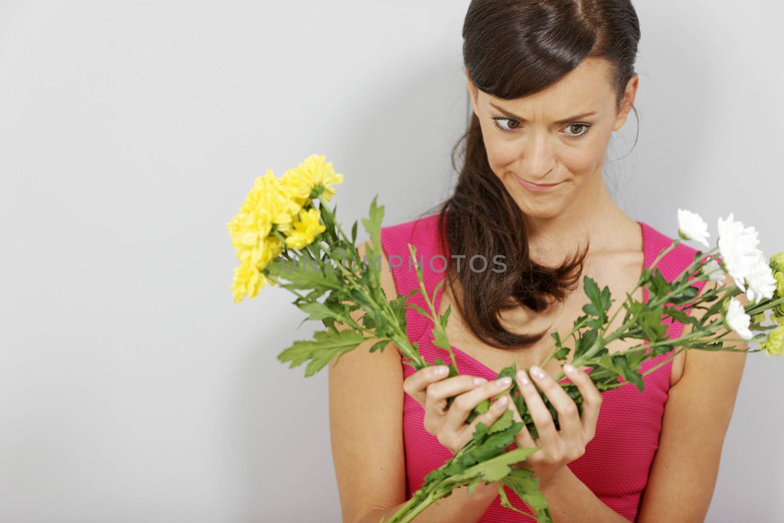 Young woman making a flower arrangement.