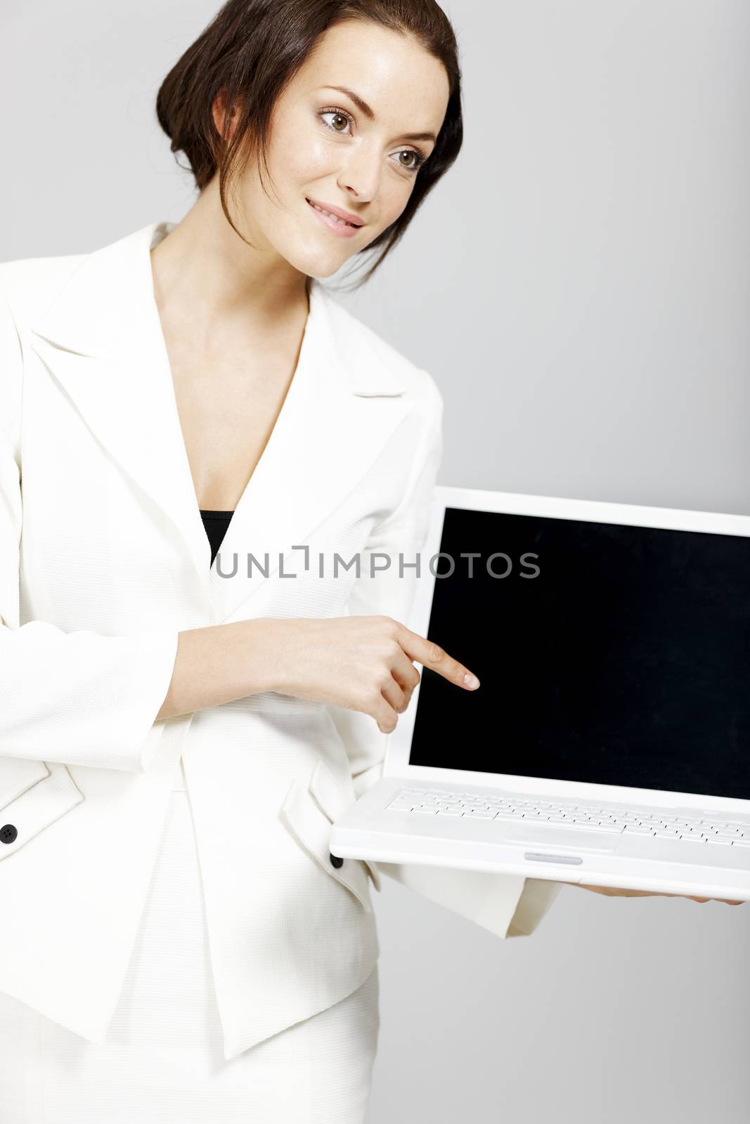 woman holding laptop by studiofi