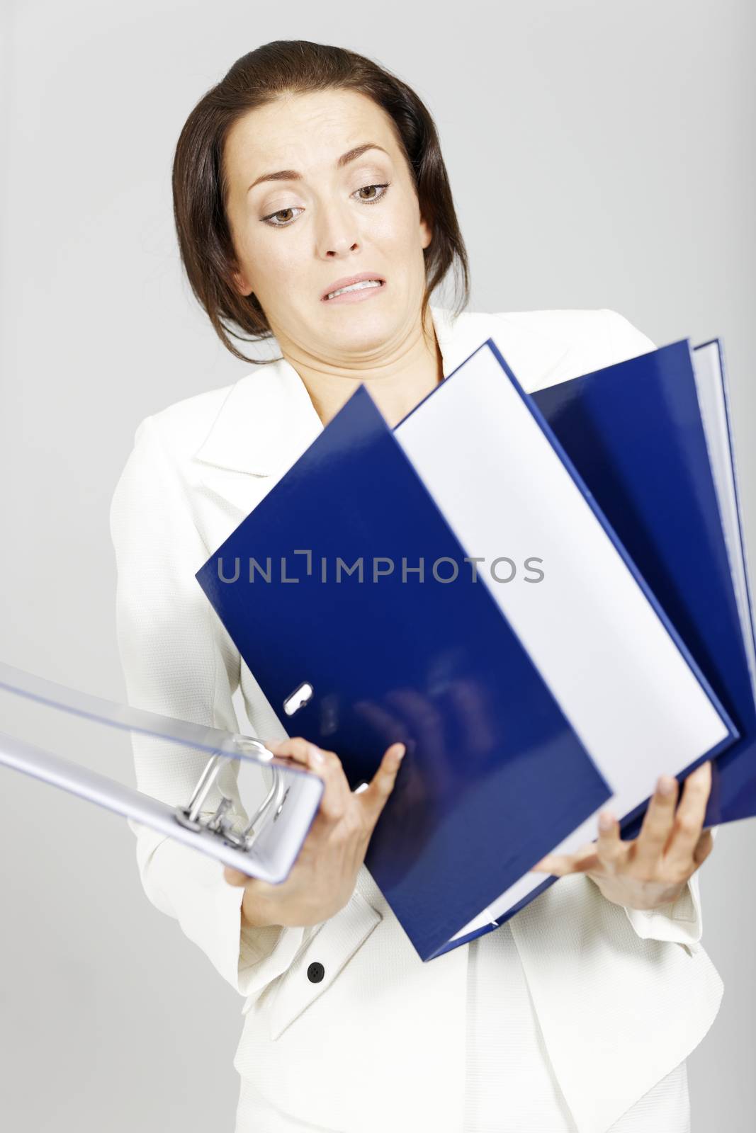 Business woman with too many folders