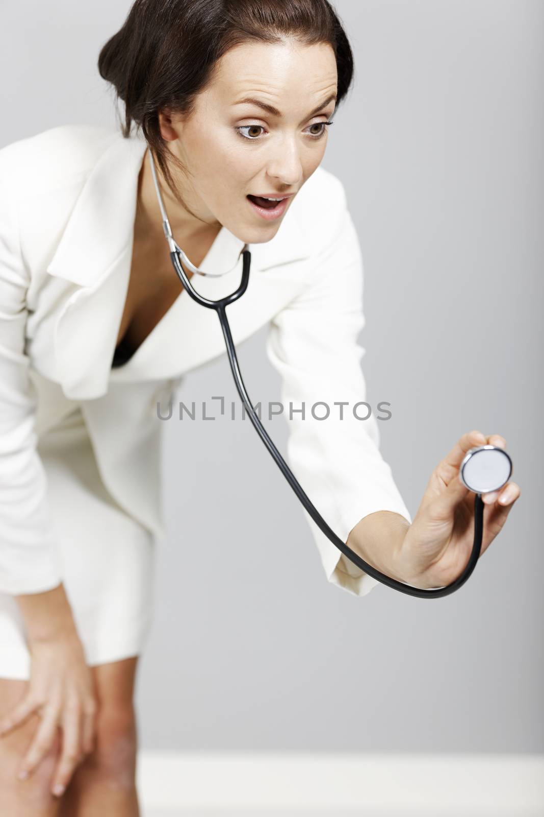 Helpful young doctor with stethoscope.