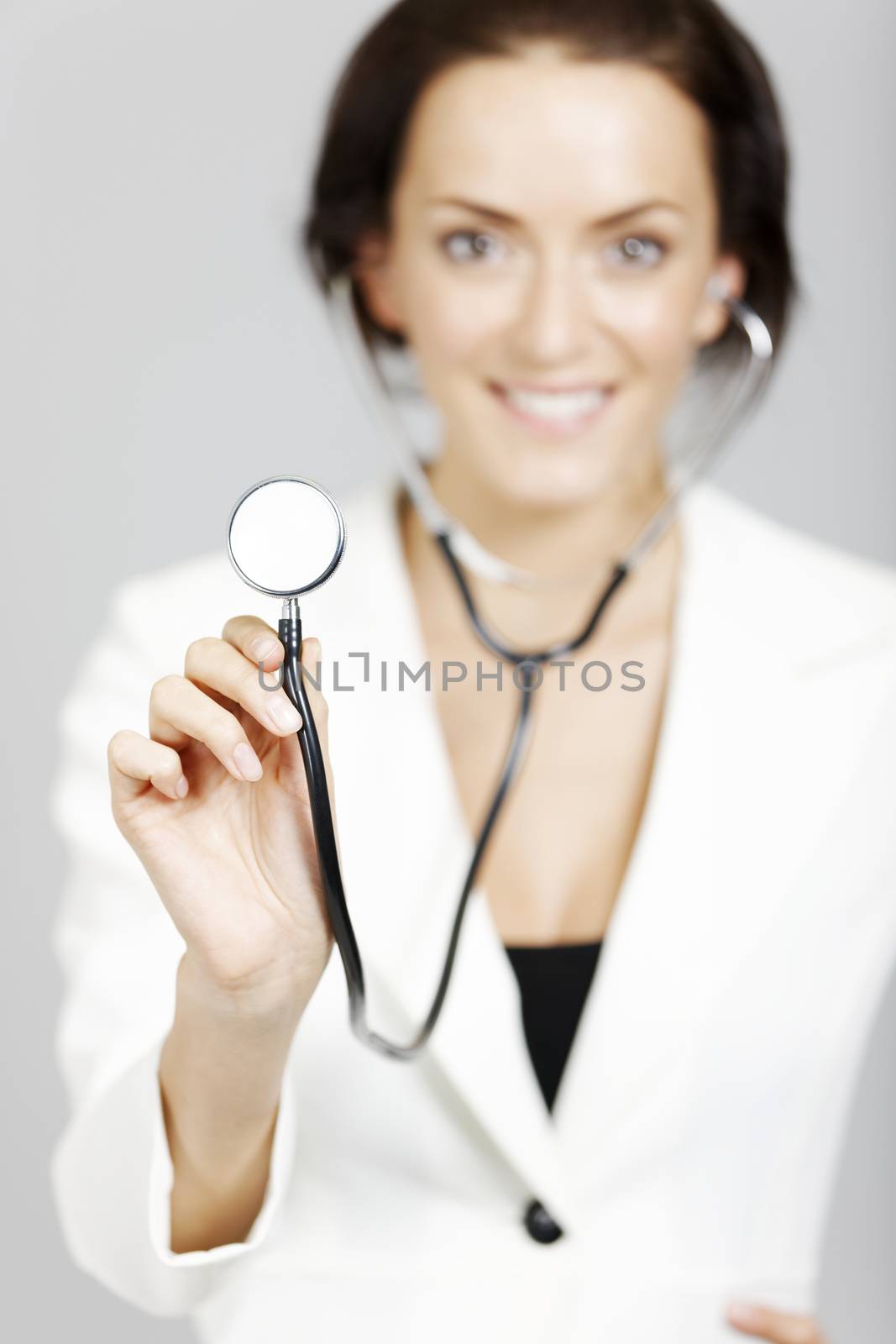 Helpful young doctor with stethoscope.