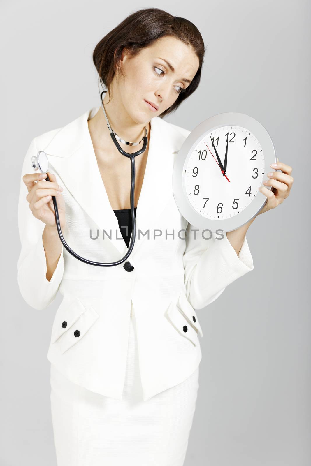 Female doctor expressing being late for an appointment.