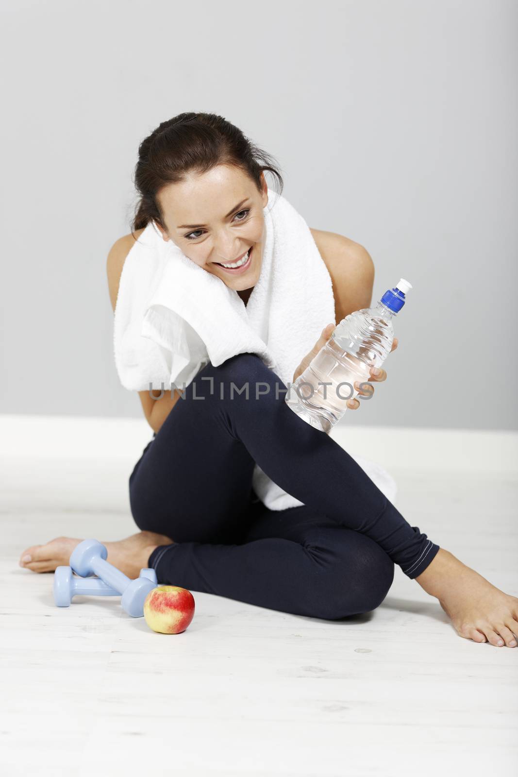 woman with water bottle after fitness training.