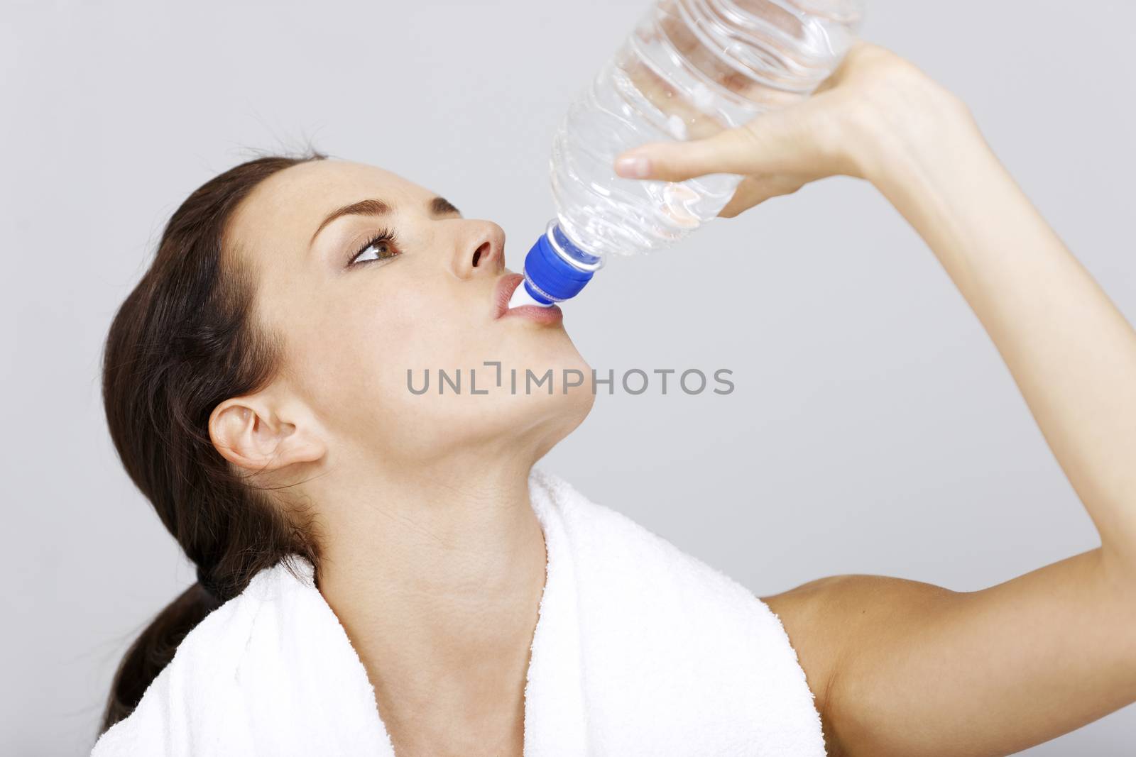 woman with water bottle after fitness training.