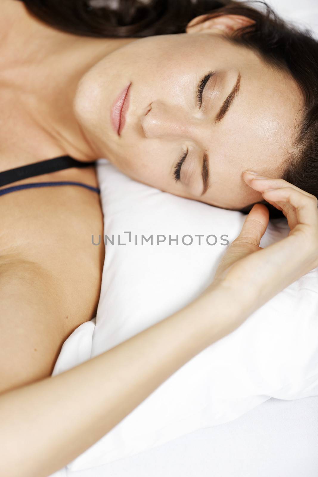 Young woman having a sleep in bed.