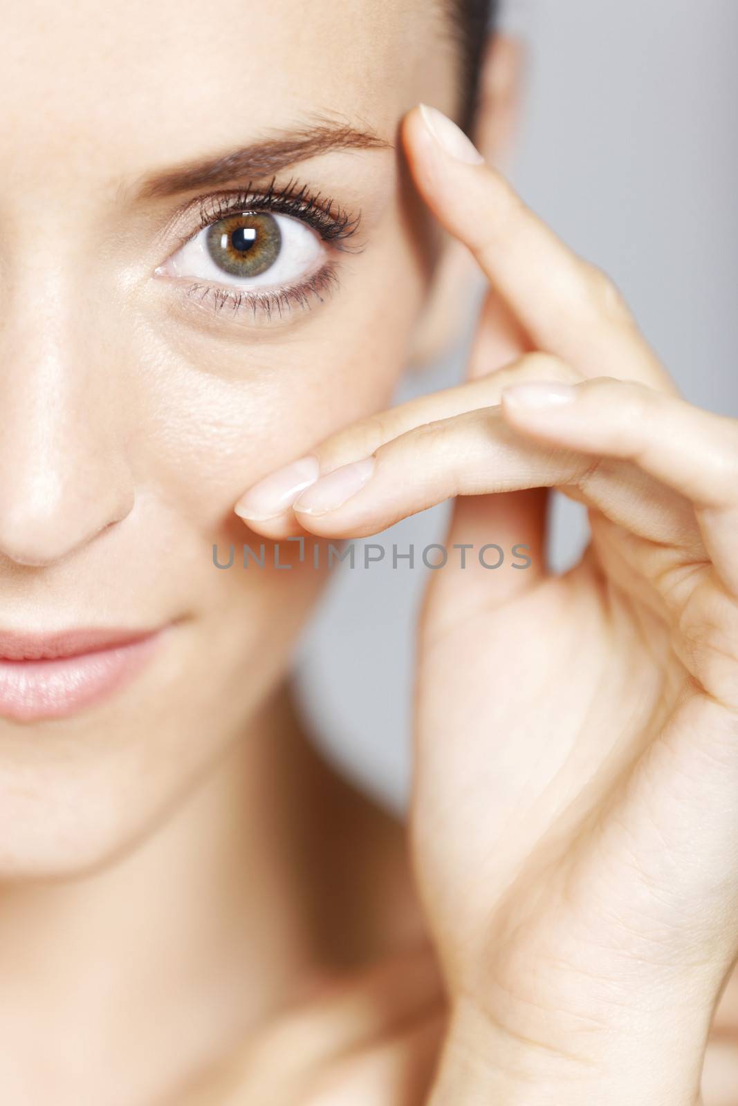 Young woman in a beauty style pose with natural skin.