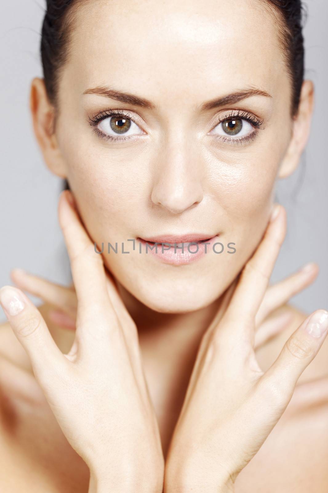 Young woman in a beauty style pose with natural skin.