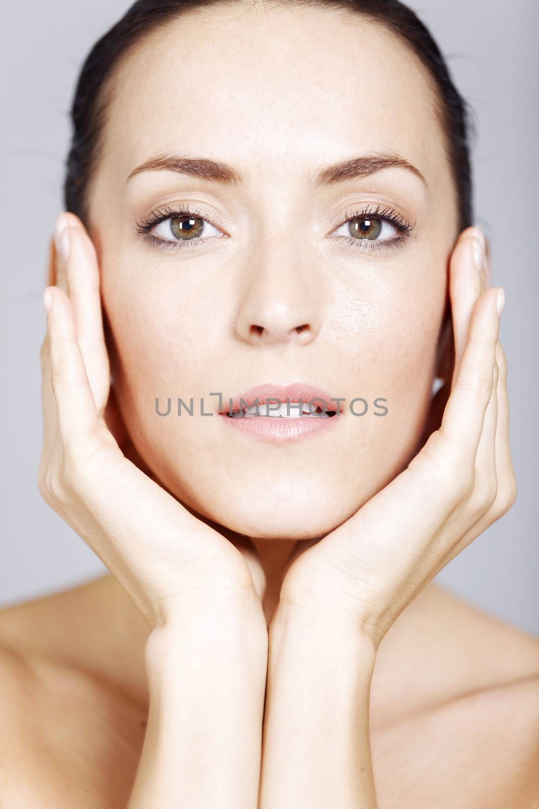 Young woman in a beauty style pose with natural skin.