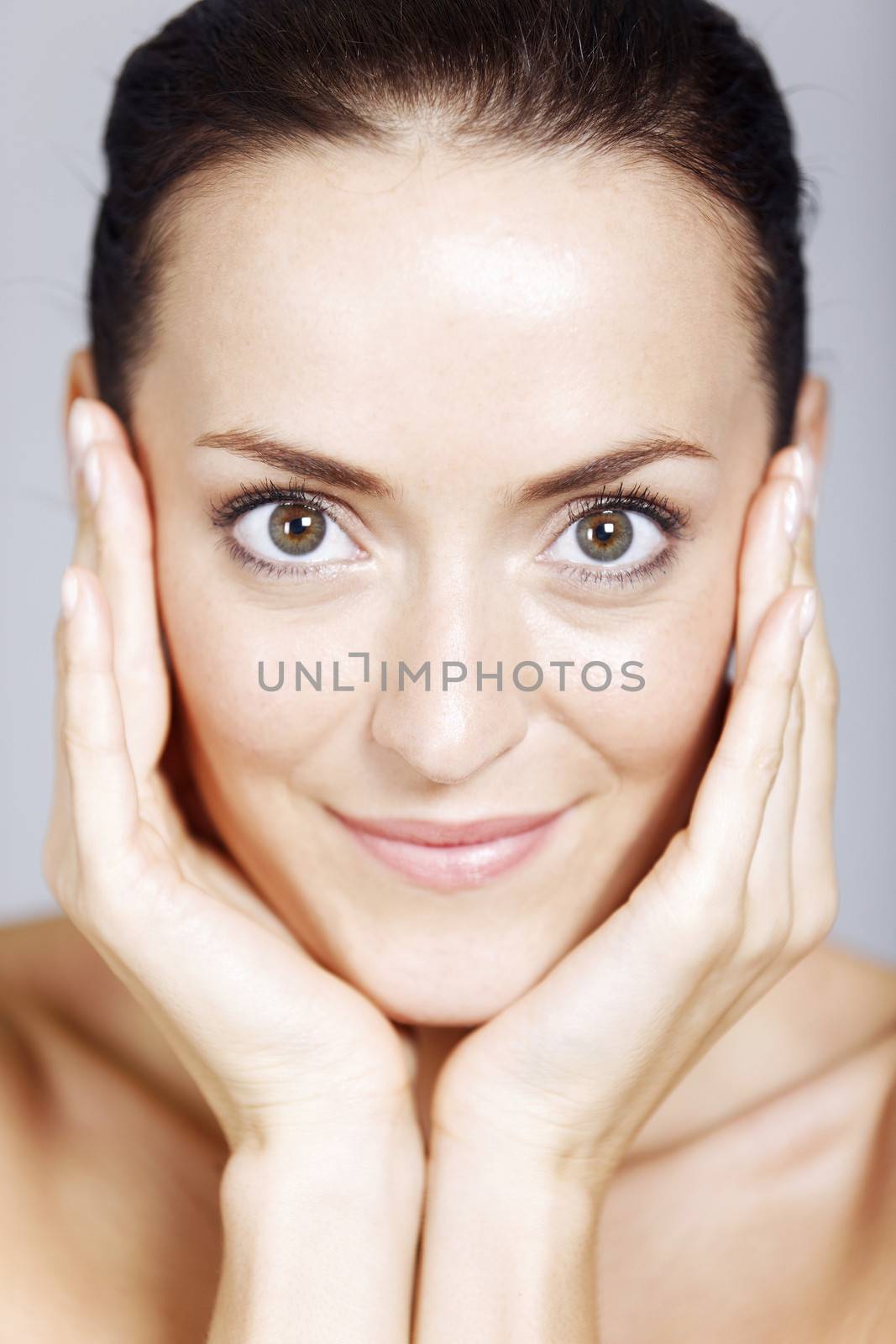 Young woman in a beauty style pose with natural skin.