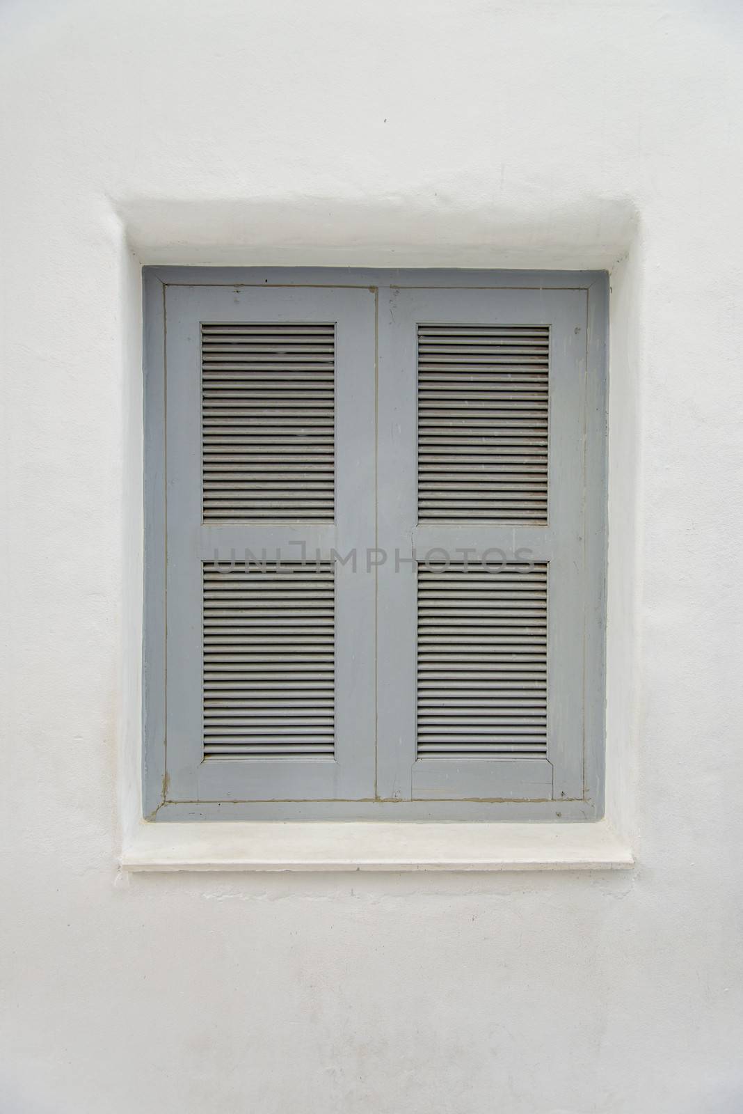 Gray wooden window on white wall1