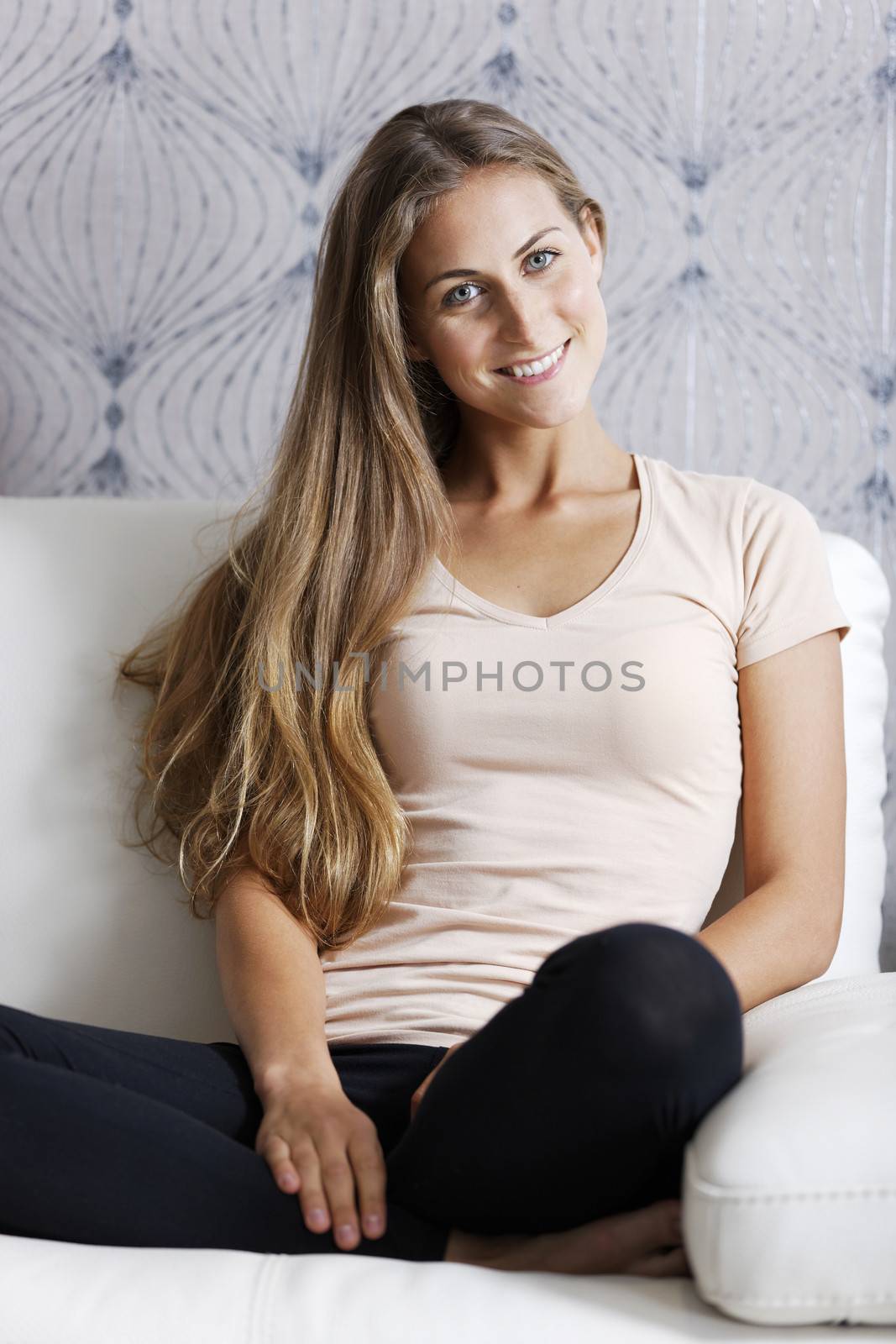 Beautiful young woman relaxing at home