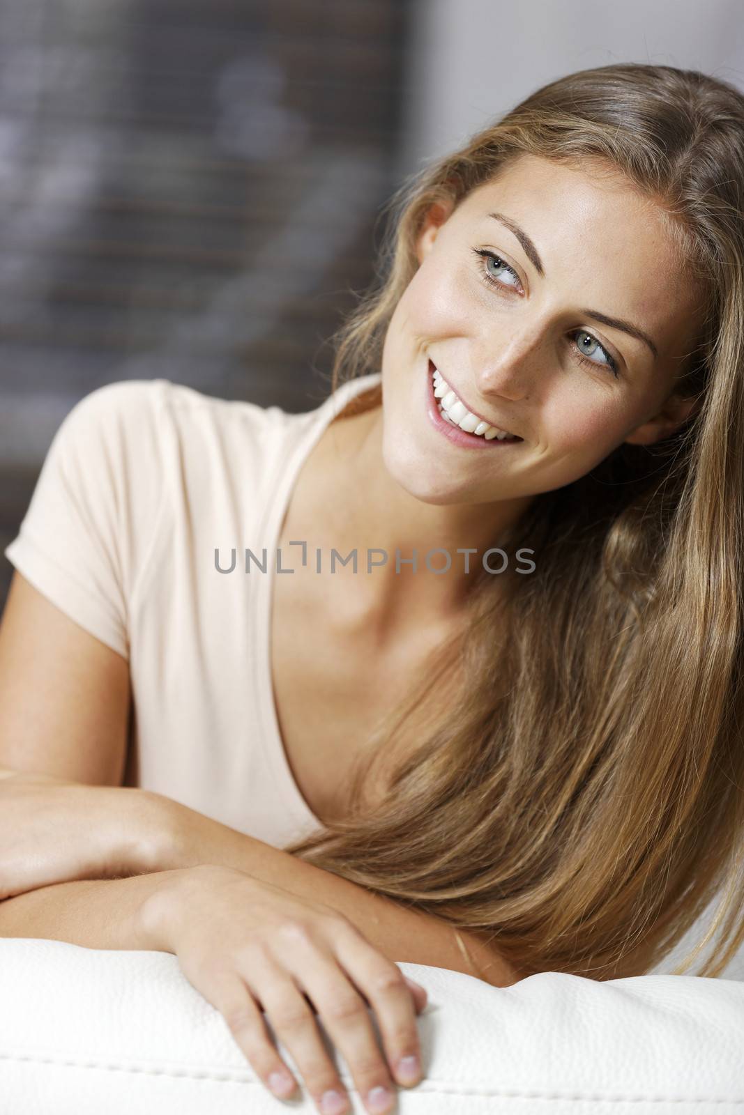 Beautiful young woman relaxing at home