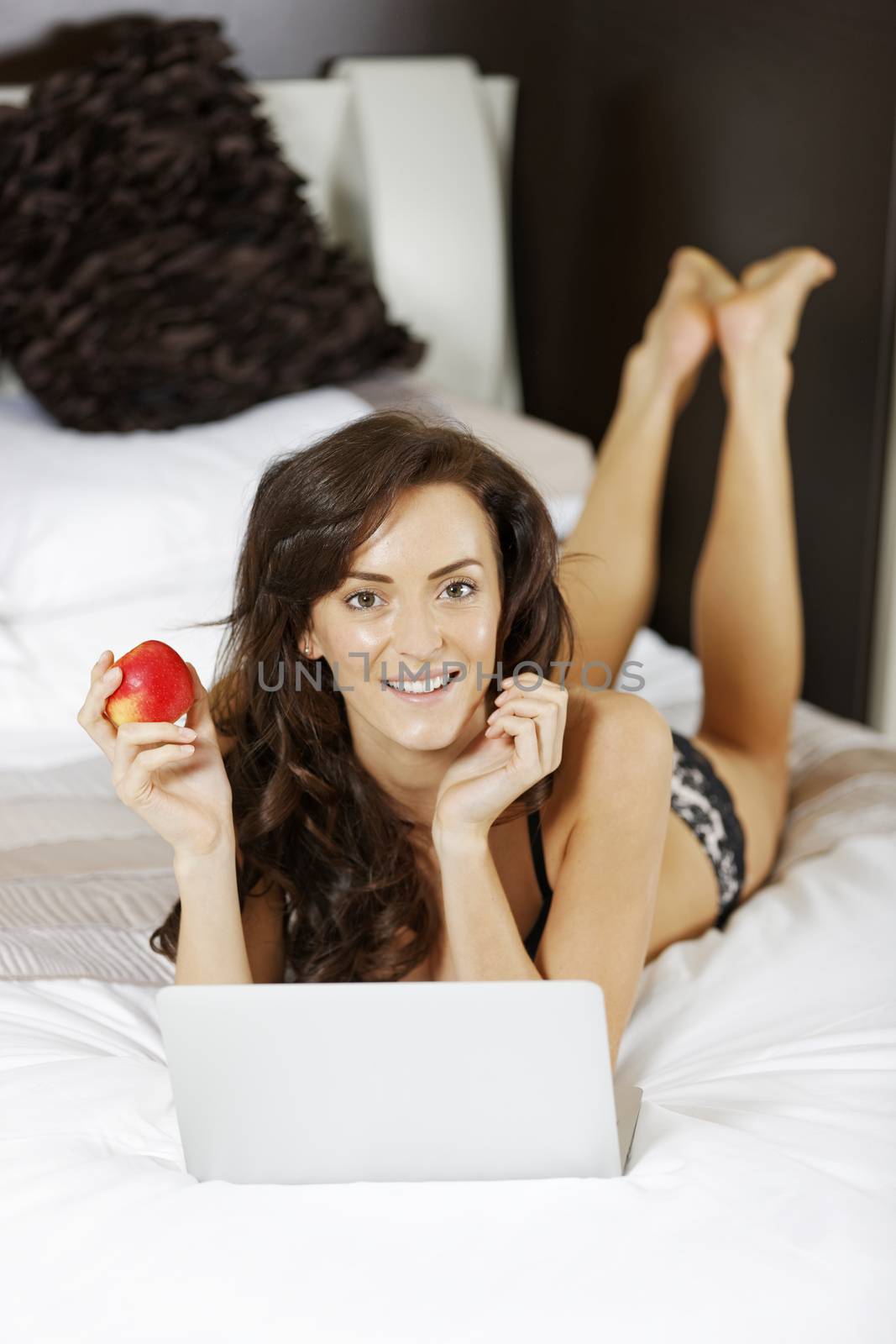 Young woman working from home on her laptop