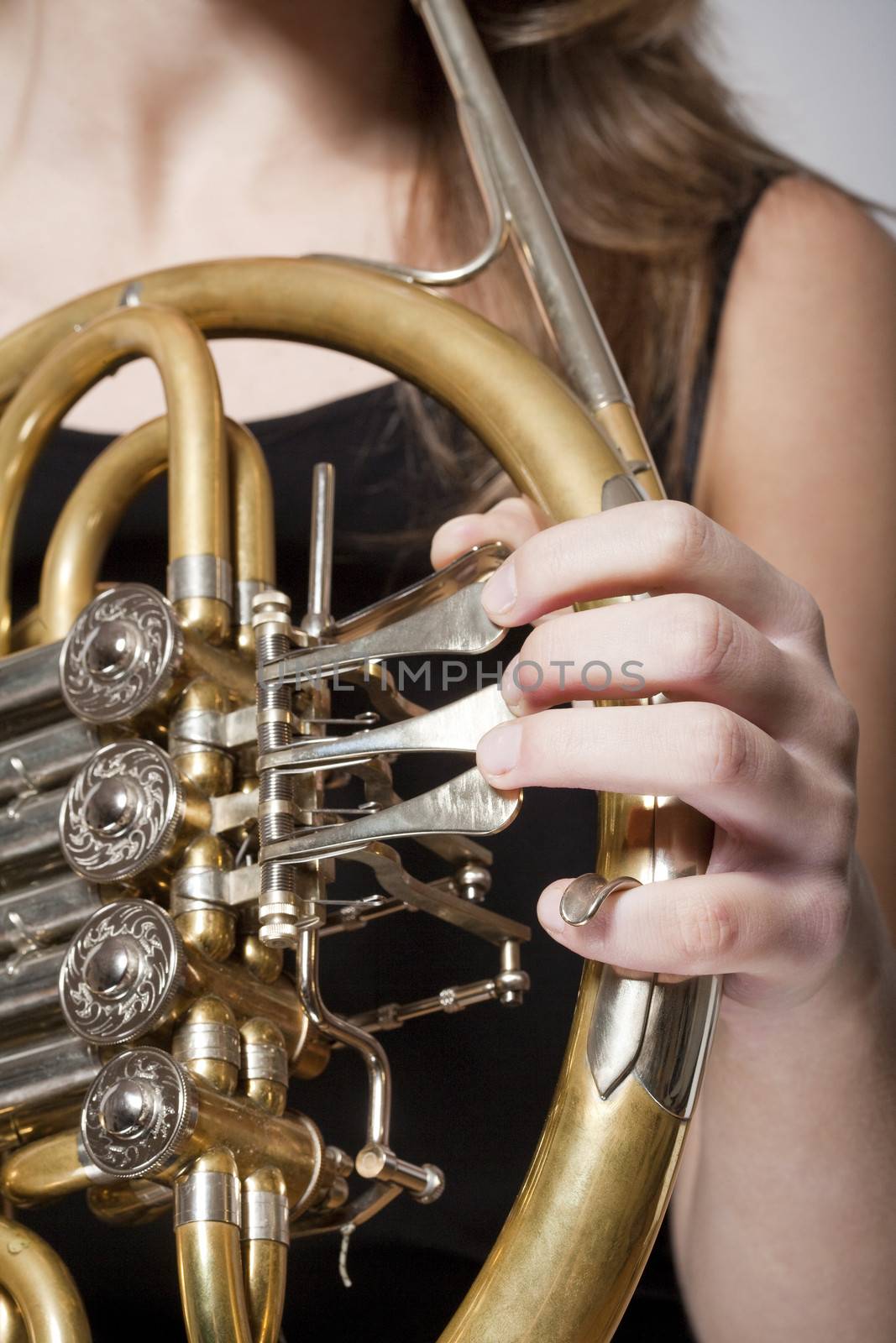 woman musician with french horn by courtyardpix