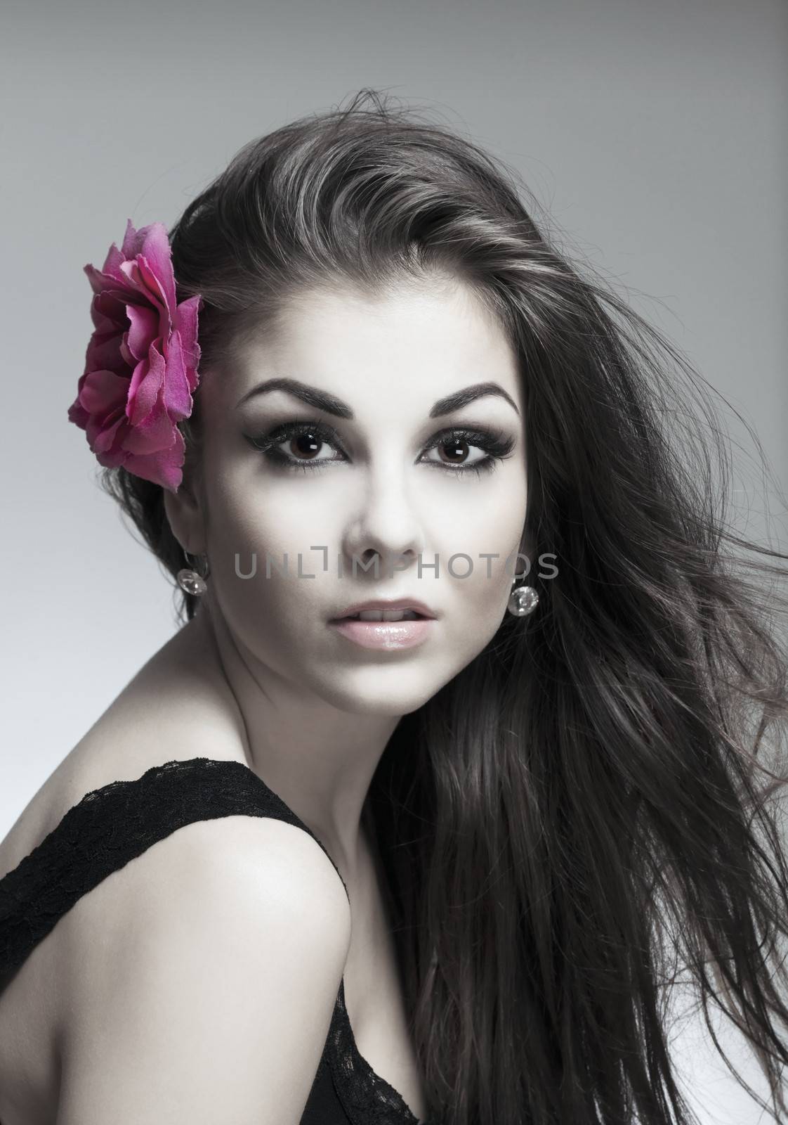 portrait of a young beautiful woman with dark hair looking