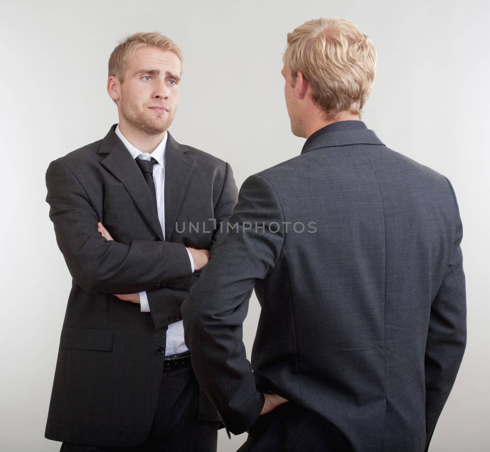 two businessmen discussing by courtyardpix